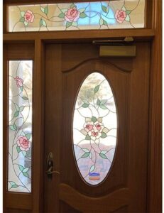 A door with a stained glass window on the outside.